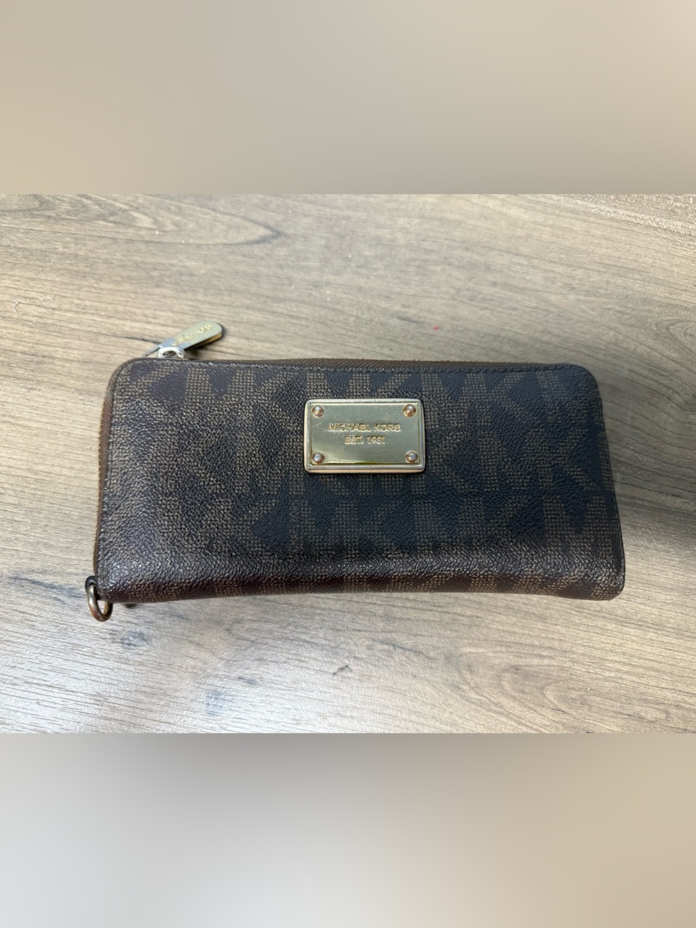Michael Kors Dark Brown Monogram Zip wallet clutch with Gold Hardware